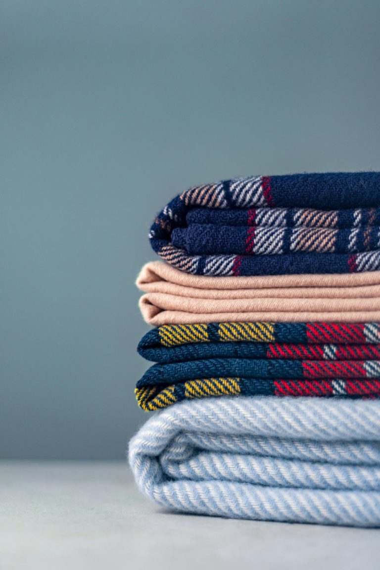 stack-woolen-checked-blankets
